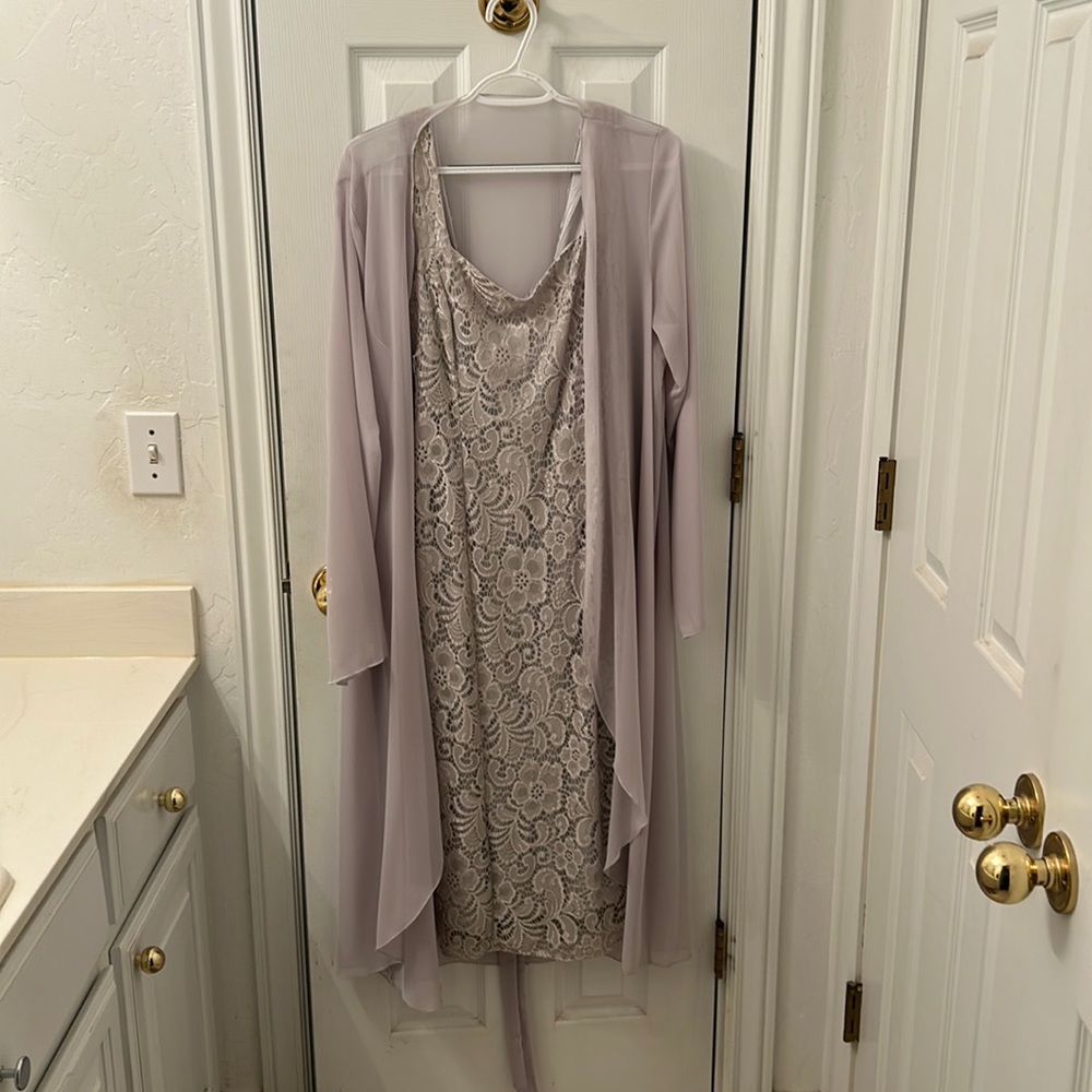 Lacey sleeveless dress with shear cover.